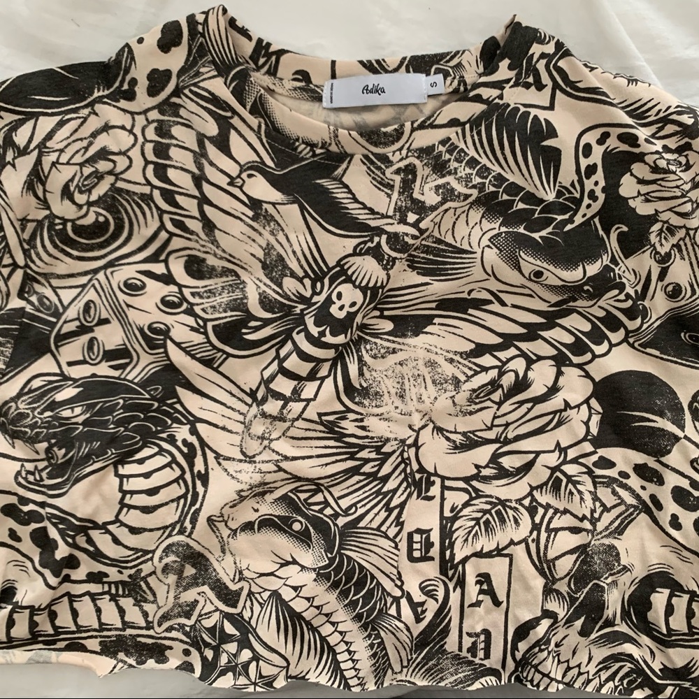 Selling an Adika tattooed designed t-shirt